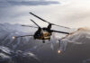 A CH-47F Chinook helicopter releases flares during a joint Army and Air Force training exercise over Bagram Airfield, Afghanistan, March 26, 2018. [USAF/TSgt Gregory Brook]