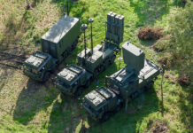 IRIS-T SLM key system components viewed from above, consisting of the command post (left), transporter, erector, launcher (TEL; middle), and radar (right). This system forms the MRAD component of ESSI. [Diehl Defence]