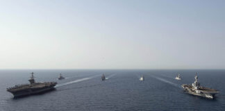 The US Navy (USN) carrier USS John C Stennis (left), the French Navy carrier FS Charles de Gaulle, and elements of their strike groups are pictured sailing together in US Fifth Fleet’s area of operations. The US, French, and UK navies are all developing ‘hybrid’ crewed/uncrewed mixes for their carrier airwing capability. [US Navy]