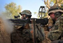 The L7A2 General Purpose Machine Gun (GPMG) in action during a counter-ambush in Afghanistan by British troops. The L7A2 is the British version of the FN MAG, arguably the most successful Western GPMG. [Crown Copyright]