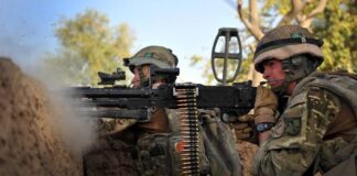 The L7A2 General Purpose Machine Gun (GPMG) in action during a counter-ambush in Afghanistan by British troops. The L7A2 is the British version of the FN MAG, arguably the most successful Western GPMG. [Crown Copyright]