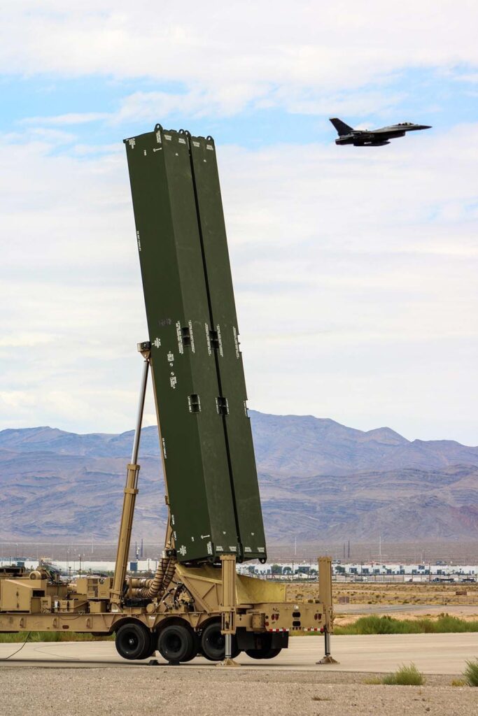 A US Air Force F-16 Fighting Falcon flies by one of the LRHW TELs assigned to B Battery, 5th Bn, 3rd FA, LRFB, 1st MDTF, participating in exercise Bamboo Eagle 24-3 on Nellis Air Force Base, Nev., 3 August 2024. [US Army/1Lt David Kim]