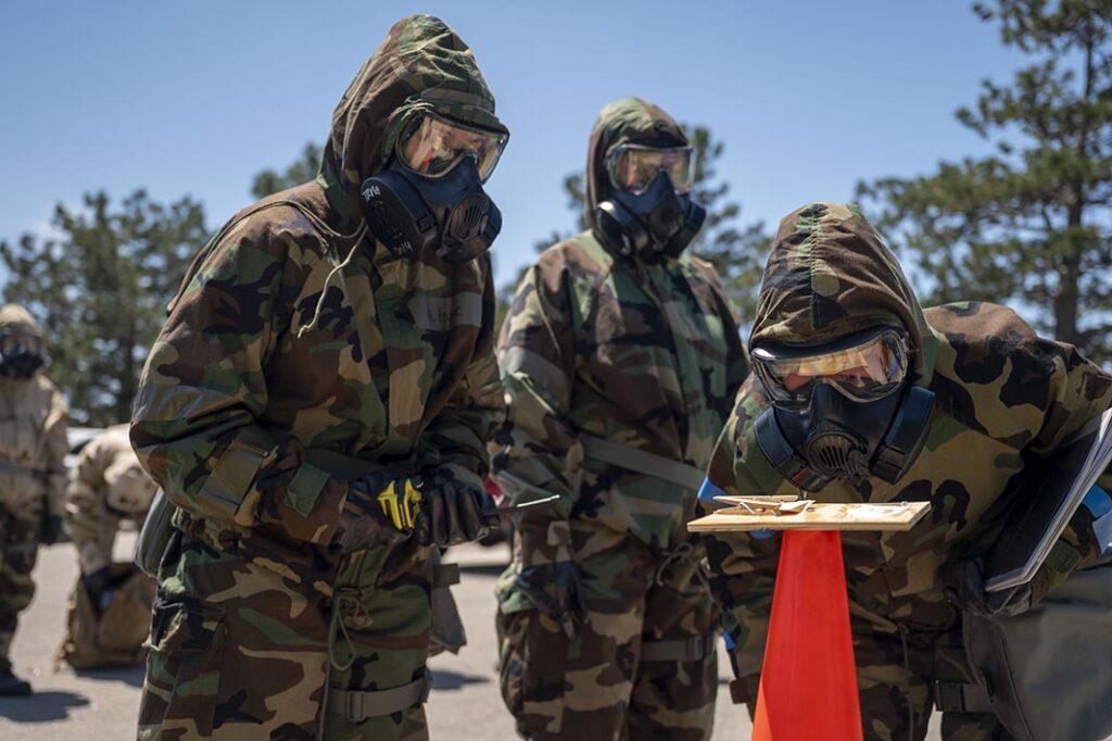 A 22nd Medical Group medical technician inspects a simulated M8 chemical detection paper during Exercise Lethal Pride at McConnell Air Force Base, Kansas, on 9 May 2024. (USAF/A1C Gavin Hameed)