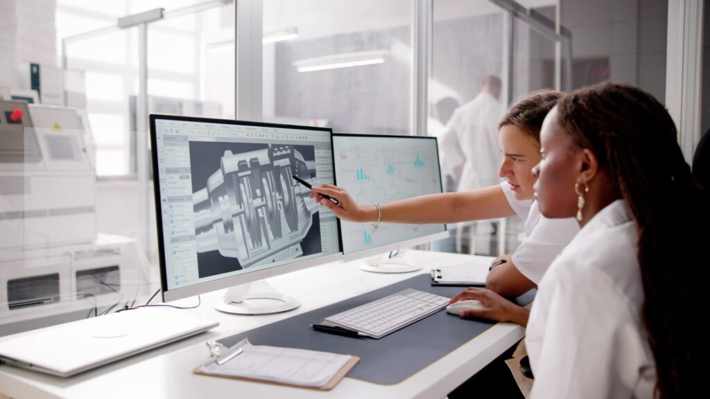Engineers looking over 3D CAD model. [Picture © AndreyPopov via Canva.com]