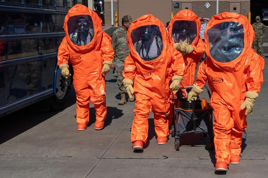 US Airmen walk in their Level A suits, the highest level of protection against any chemical vapour or splash field, during a field training exercise at Goldwater Air National Guard Base, Phoenix, on 31 January 2025. (US ANG/MSgt Michael Matkin)