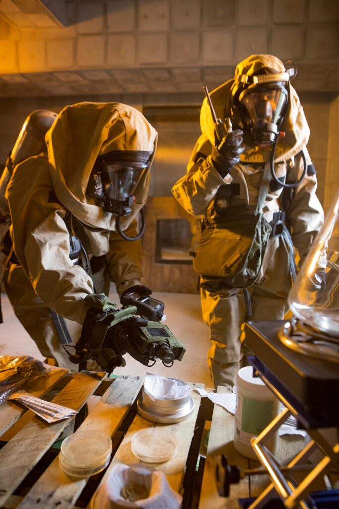 Specialists with the CBRN response element (CRE), 31st Marine Expeditionary Unit, detect and report possible chemical contamination while conducting CBRN response training at Camp Hansen, Okinawa, Japan, on 1 February 2017. (USMC/Cpl Darien J. Bjorndal)
