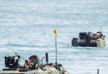 Amphibious armoured vehicles are designed to transit the open ocean when moving from ship to shore. Here USMC ACVs prepare to re-embark on their amphibious assault ship in the Pacific Ocean off the California coast, on 14 September 2025. [USMC/Cpl Joseph Helms]