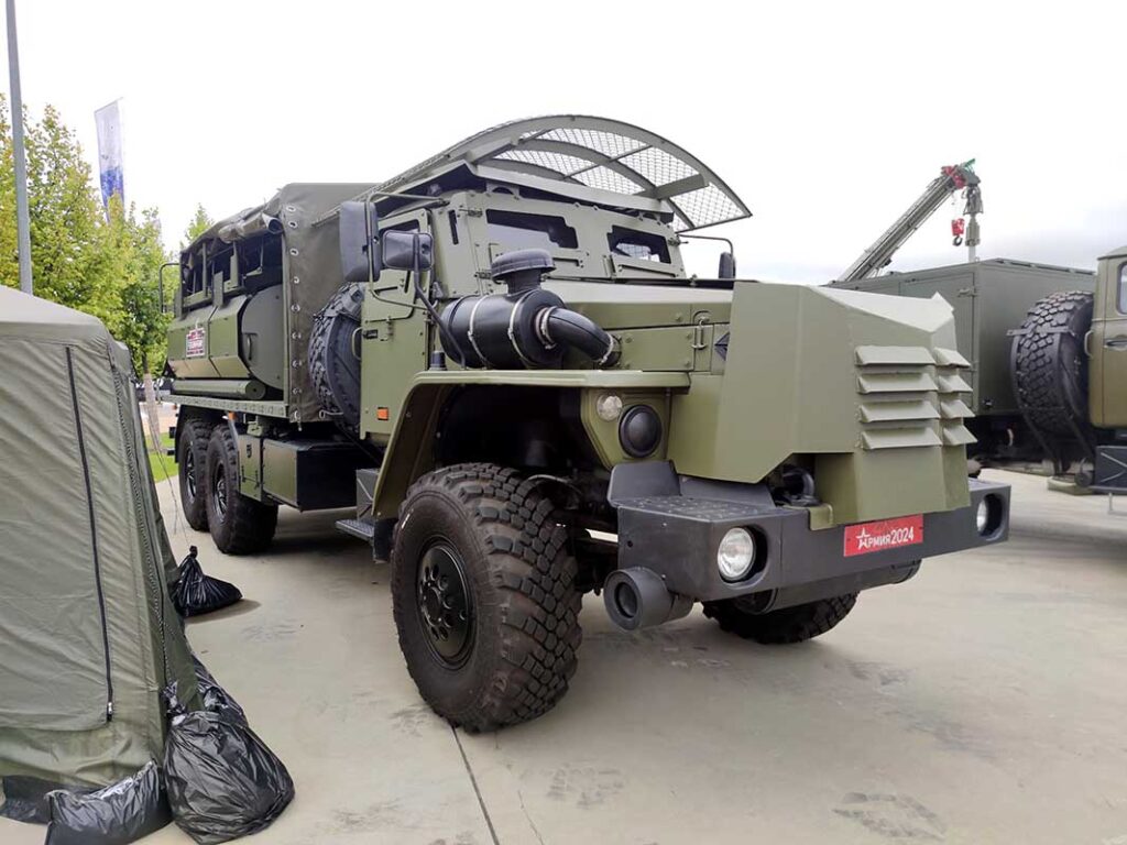 Protected fuel tanker ATZ-8-4320, fitted with an armoured cab. To conceal its role and resemble a standard cargo truck, it is equipped with a canvas-covered frame. [Alexey Tarasov]